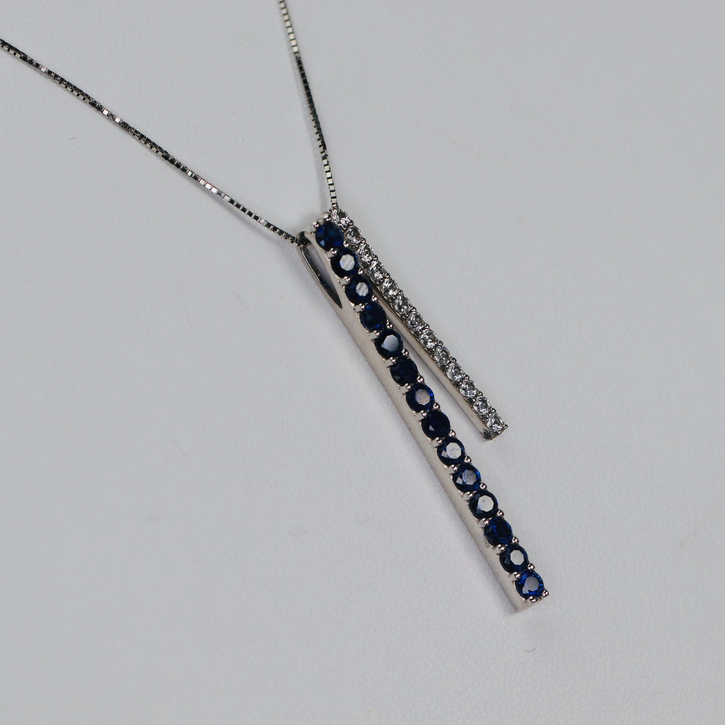 Blue and white lab grown sapphire necklace in white gold